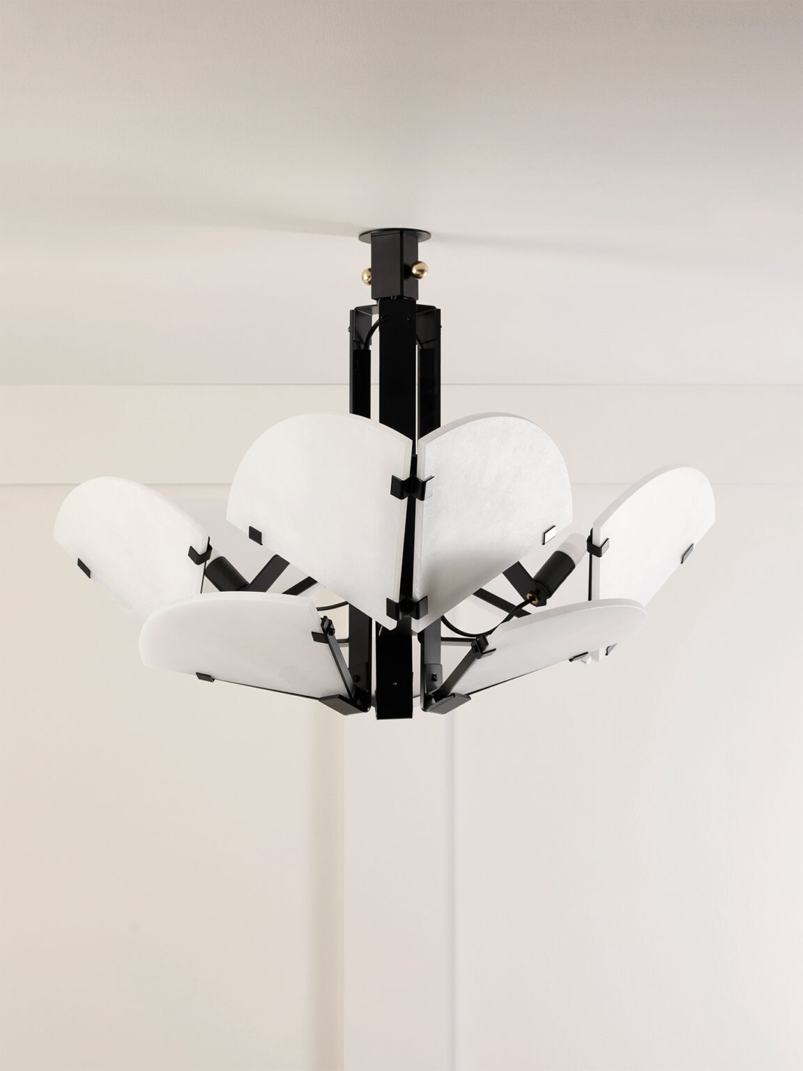 Mcde-sus-102a-008-1152x1536 | rewire Modern pendant chandelier with a black central frame and white curved panels forming a flower-like shape
