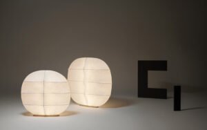 two floor screens that double as lamps and resemble tortoise shells