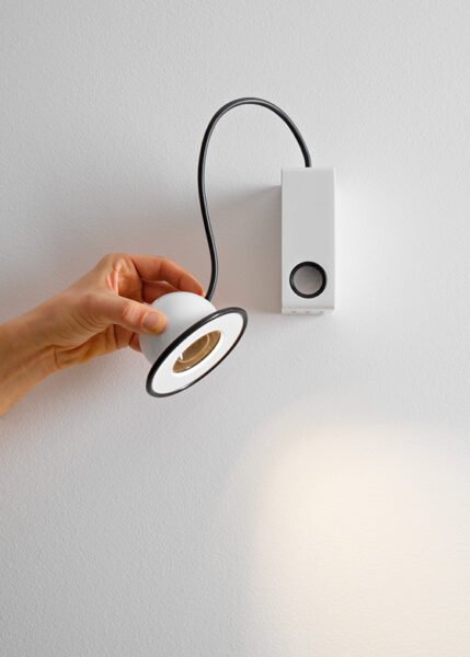 The Minibox sconce has a metal body and an adjustable luminous eye.