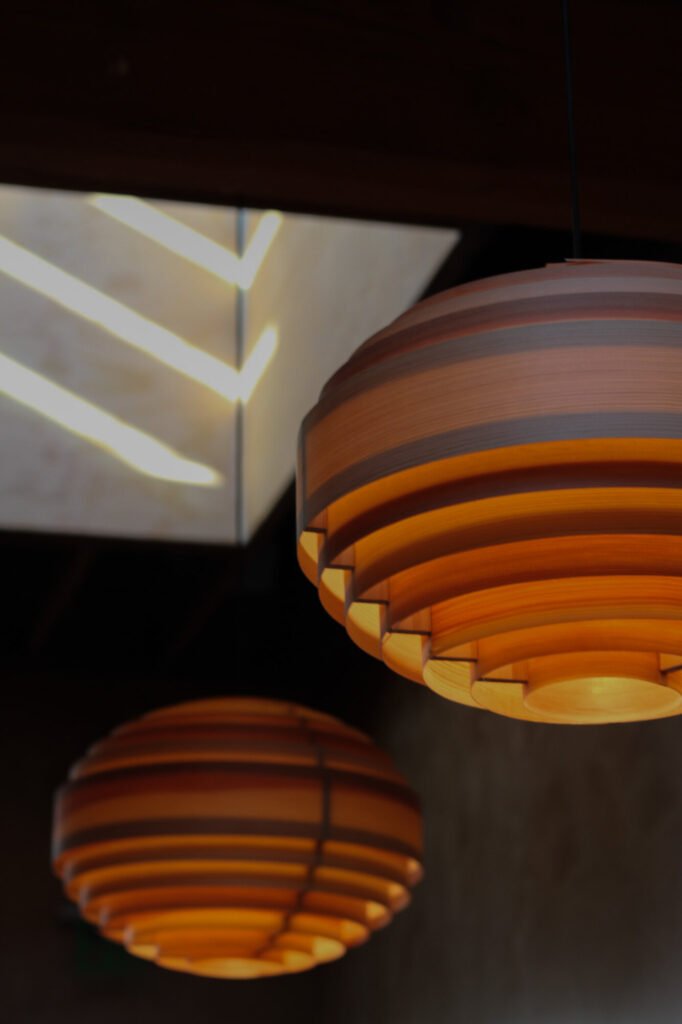 Lighting detail at Etra - rewire wooden globe lighting