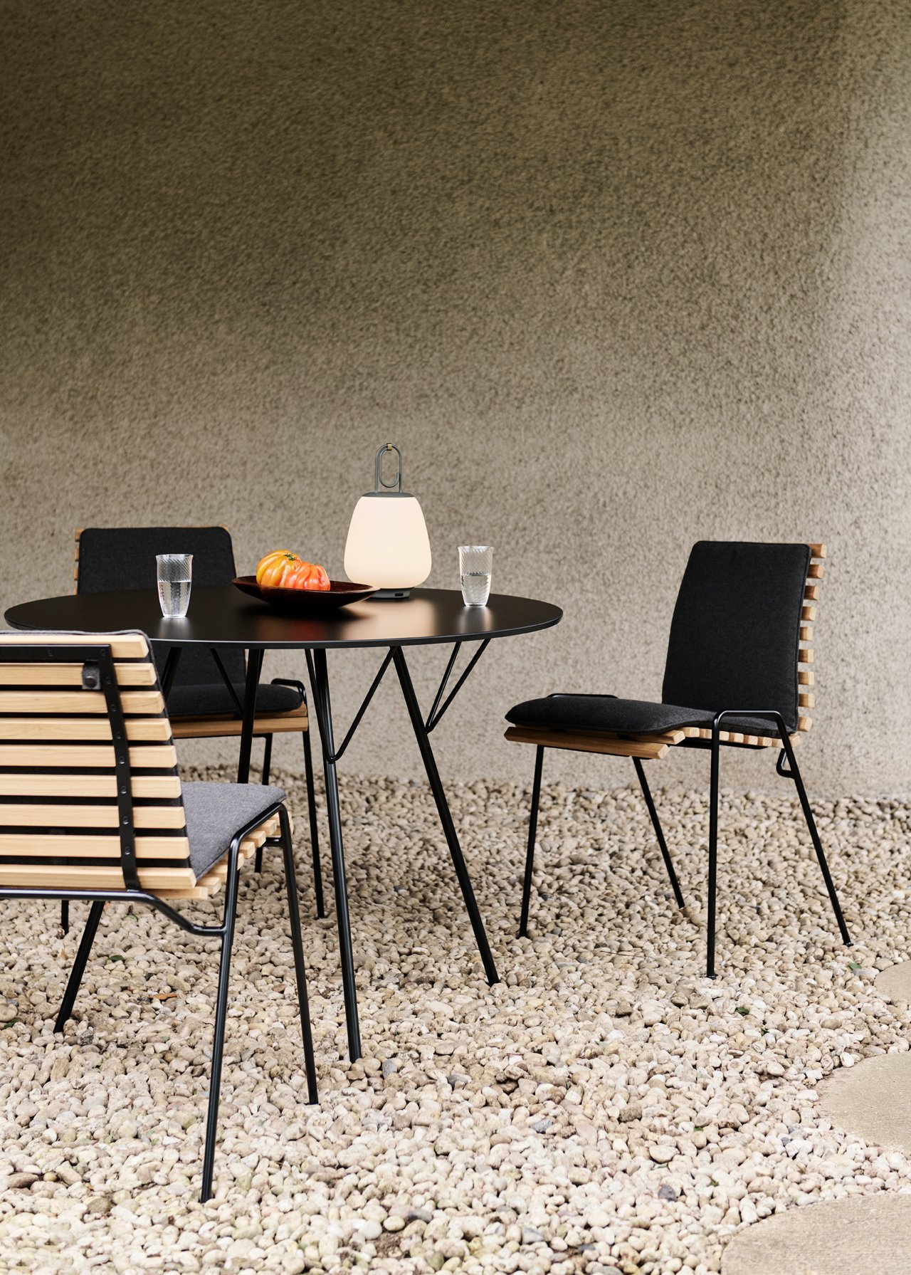 Atd_retail_2024_rfh-terrace-chair-rd4_rfh-terrace-outdoor-cushion-rd4_rfh-terrace-table-rd6_collect-glass-sc60_lucca-sc51_dark | rewire Lucca for &Tradition