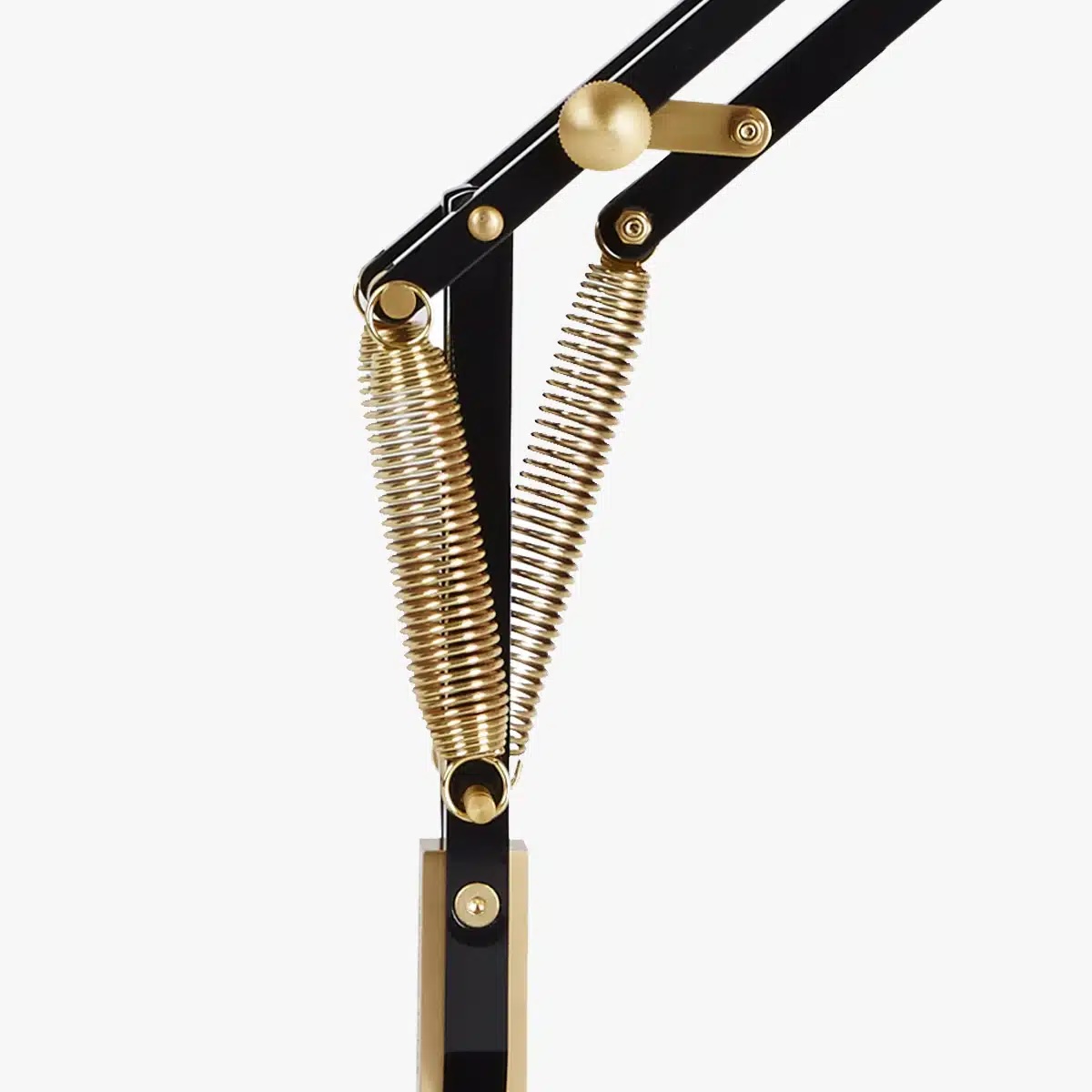 Original-1227-brass-desk-lamp-deep-slate-4jpg | rewire Close-up of a black adjustable microphone boom with gold springs and joints, showing the pivoting arm mechanism.