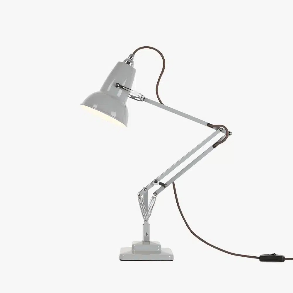 Original-1227-mini-desk-lamp-dove-grey-2-offjpg | rewire Grey adjustable desk lamp with hinged arms and a clamp base, plugged in via a brown cord trailing to the right