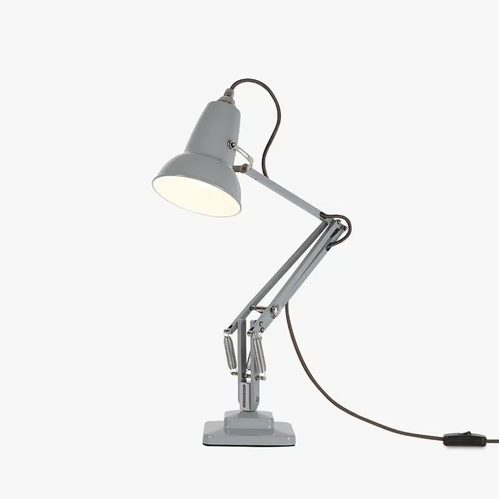 Original-1227-mini-desk-lamp-dove-grey-3-offjpg | rewire Gray metal adjustable desk lamp with hinged arms and a corded plug, lit and ready to use