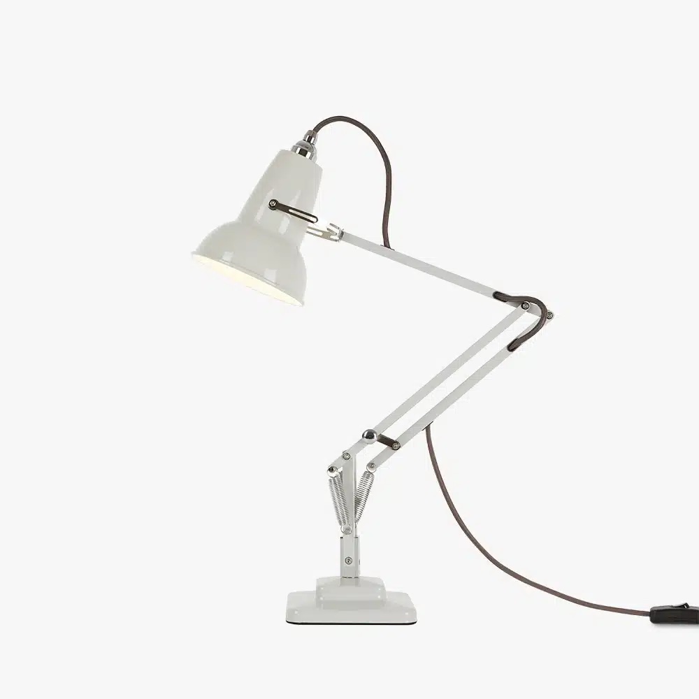 Original-1227-mini-desk-linen-white-2jpg | rewire White adjustable desk lamp with a clamp base, articulated arms, and a conical shade, connected to a long power cord.