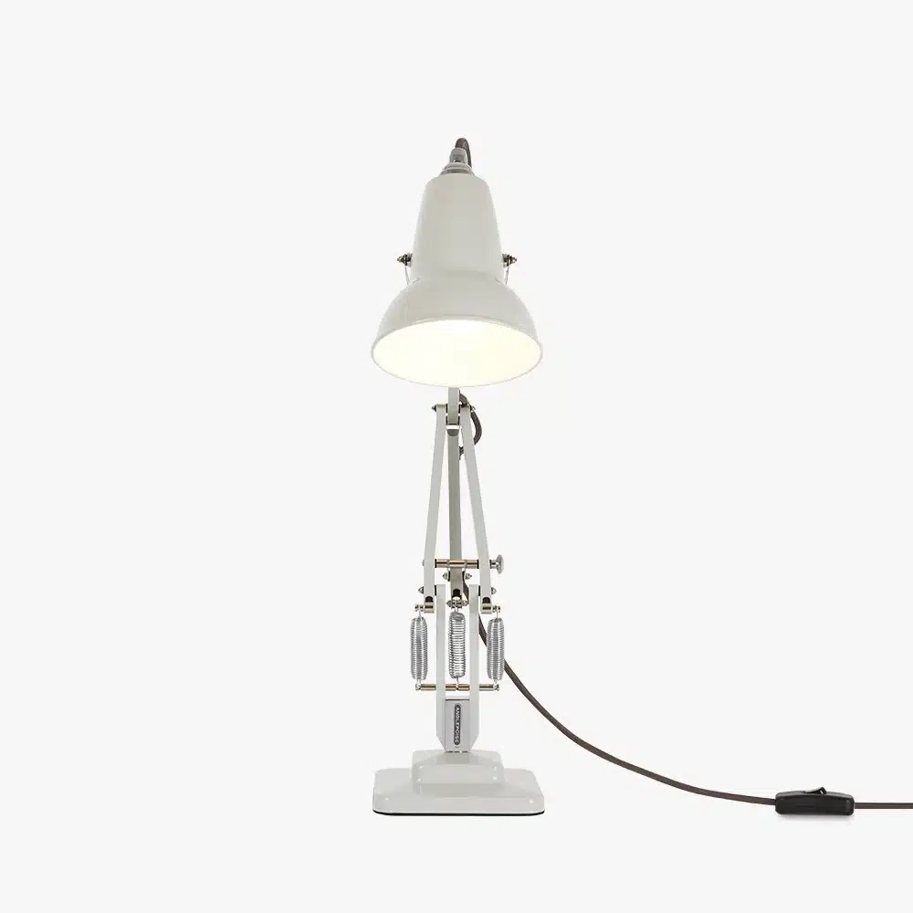 Original-1227-mini-desk-linen-white-4jpg | rewire White adjustable desk lamp with articulated arms and a power cord trailing to the right.