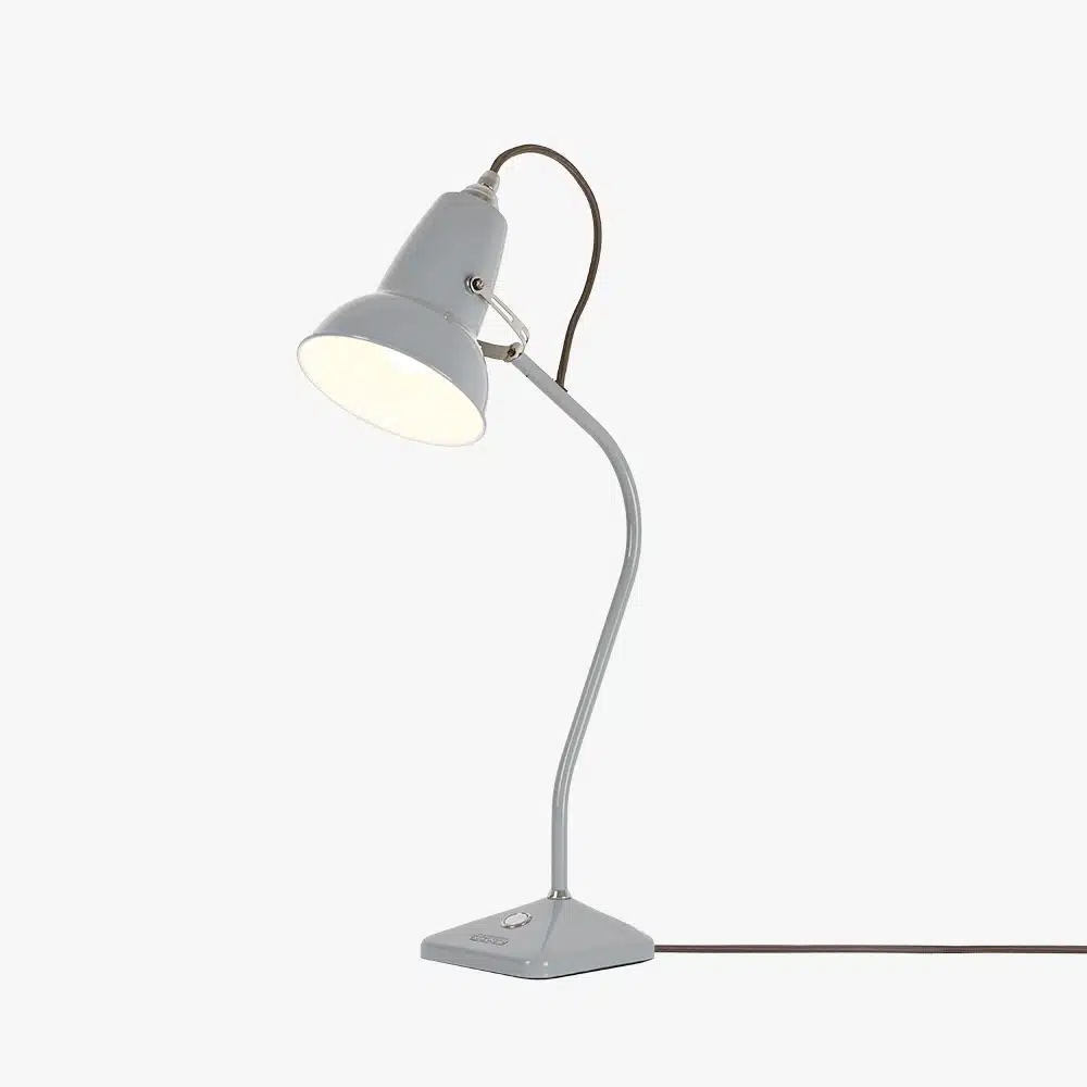 Original-1227-table-lamp-dove-grey-2jpg | rewire Gray adjustable desk lamp with curved neck and a shade, plugged in with a power cord visible on the right.
