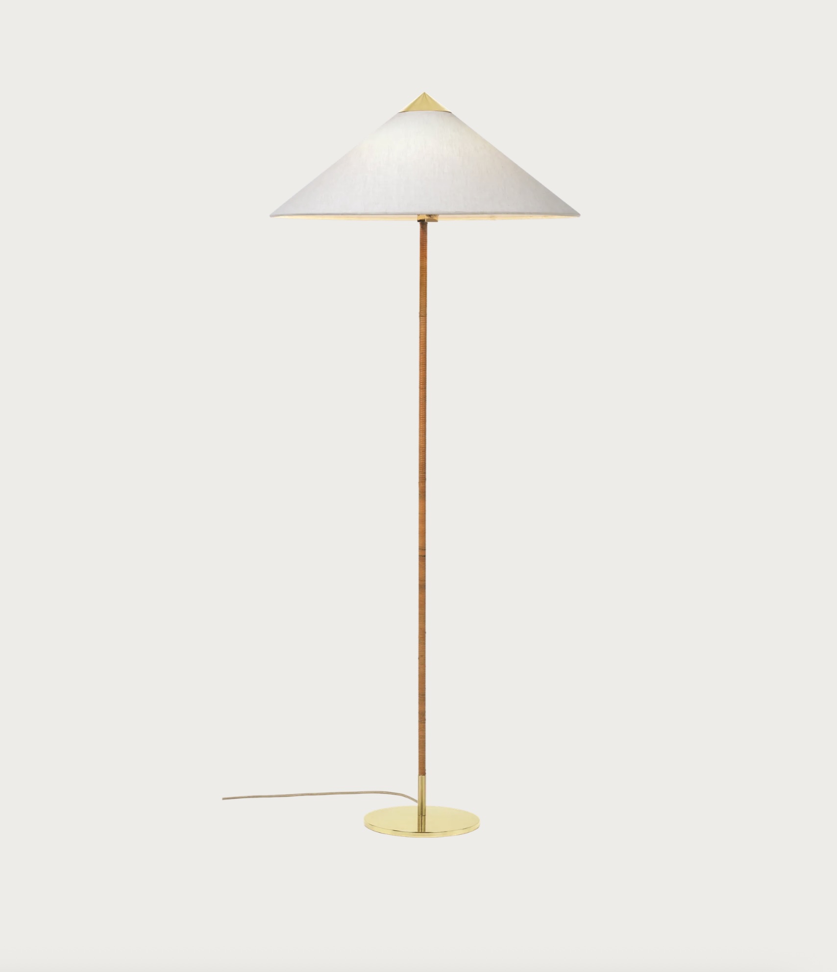 Screenshot | rewire Gold floor lamp with a tall slender copper stem, a large cream conical shade, and a circular gold base; cord extends to the left.